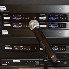 photo of audio visual controllers and microphone